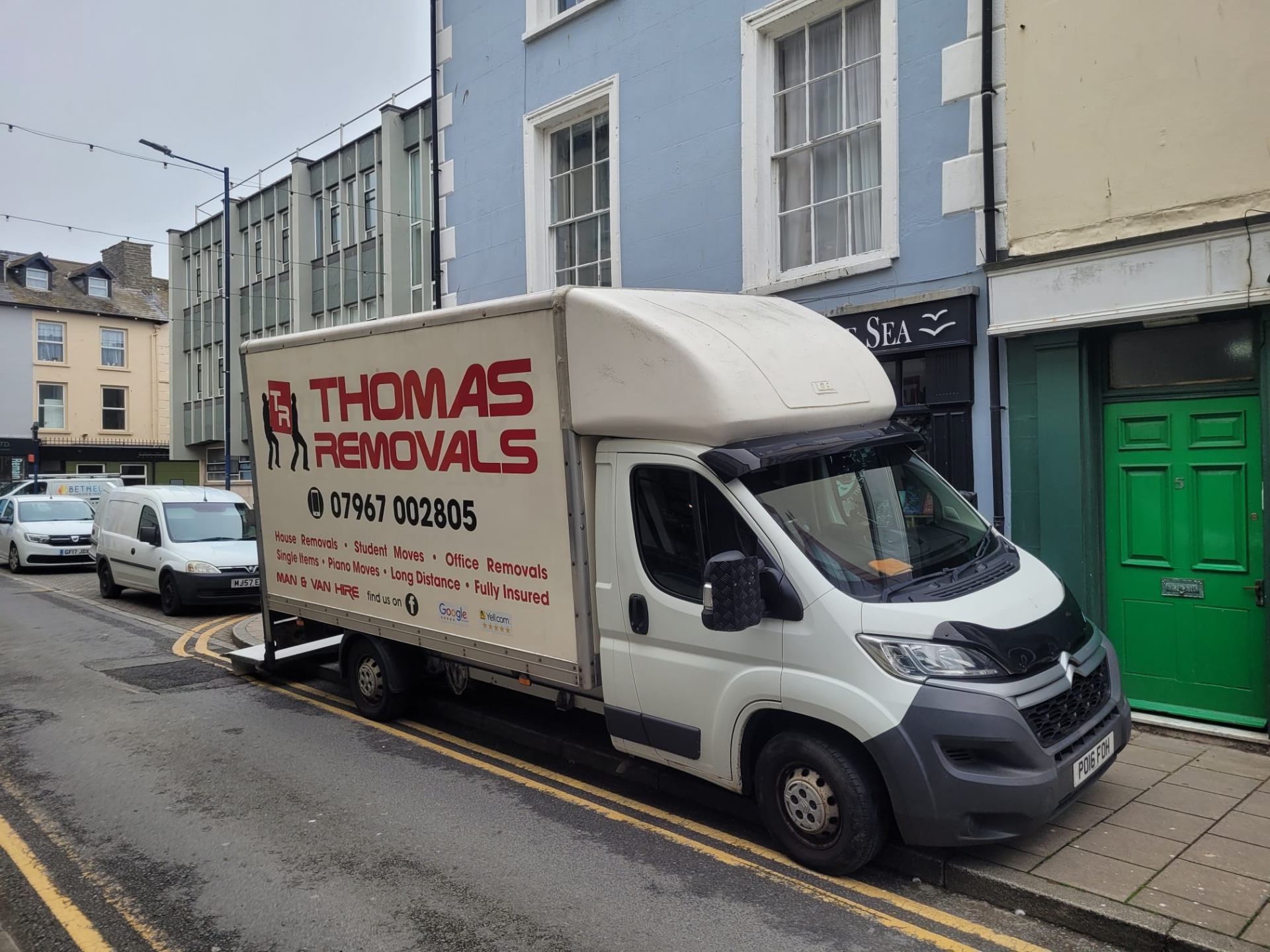 Thomas Removals van in a Welsh town centre ready for a man and van collection