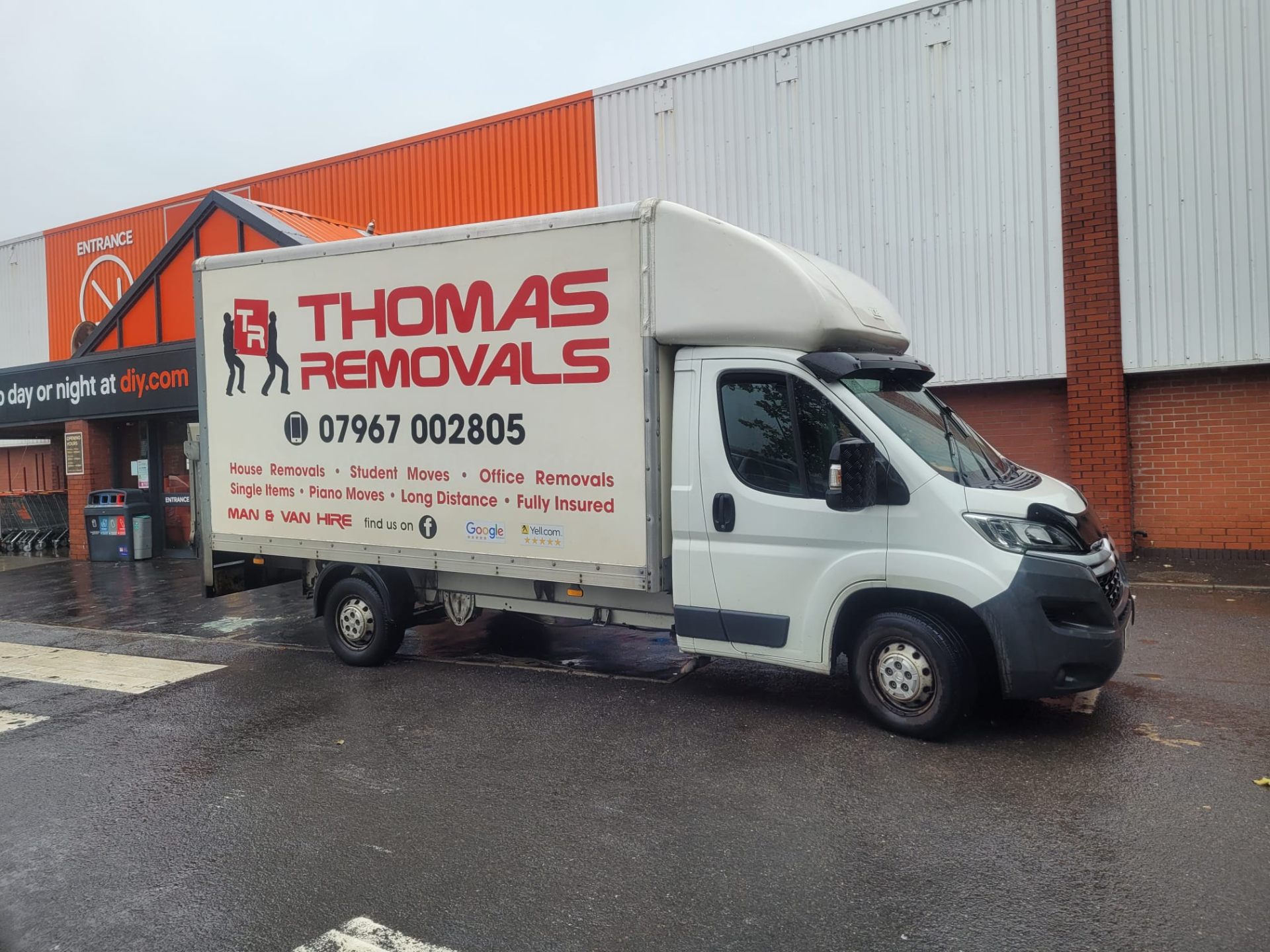 Thomas Removals van outside a DIY store for a furniture collection