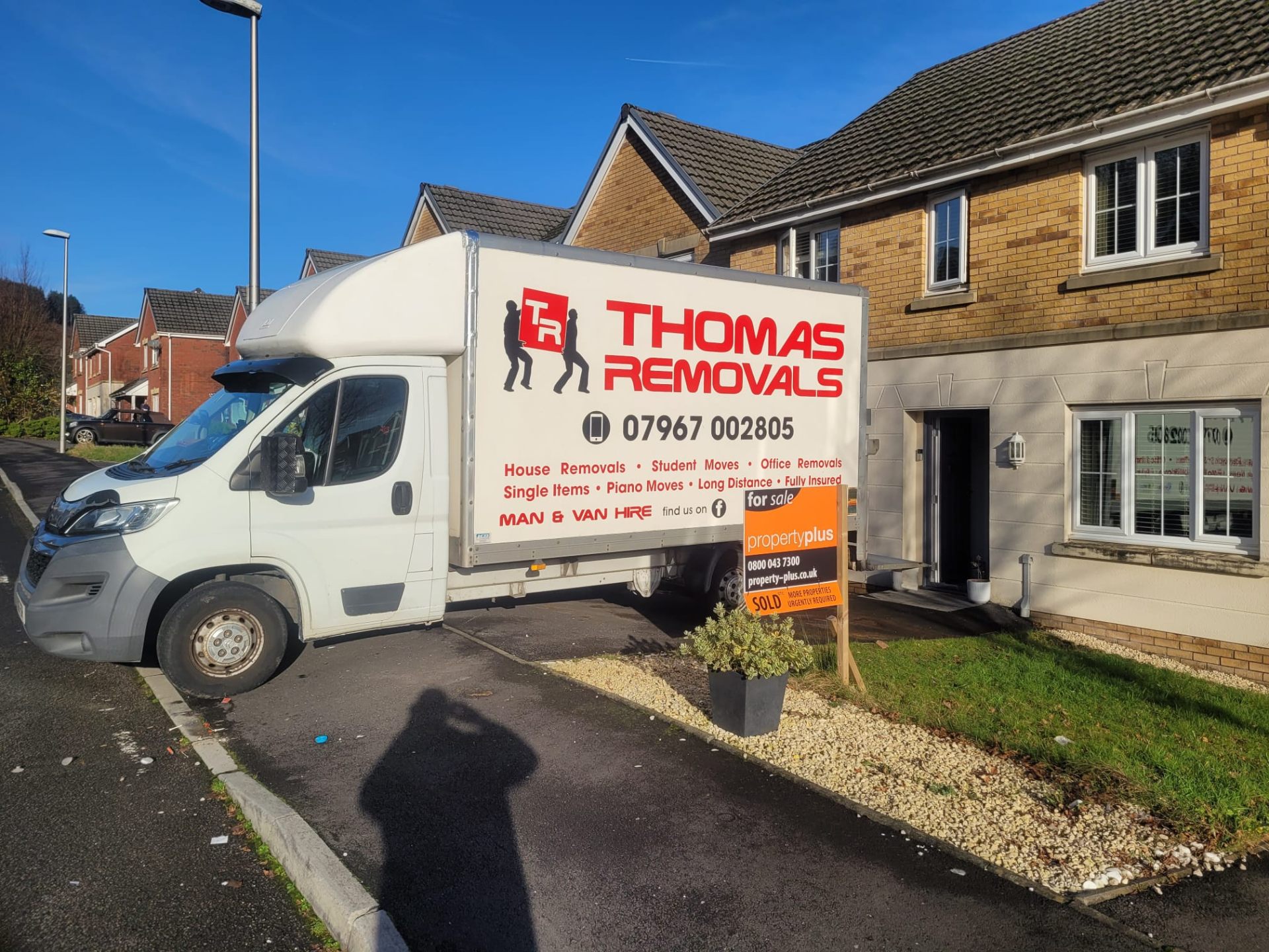 Thomas Removals van outside a semi-detached property with a sold sign